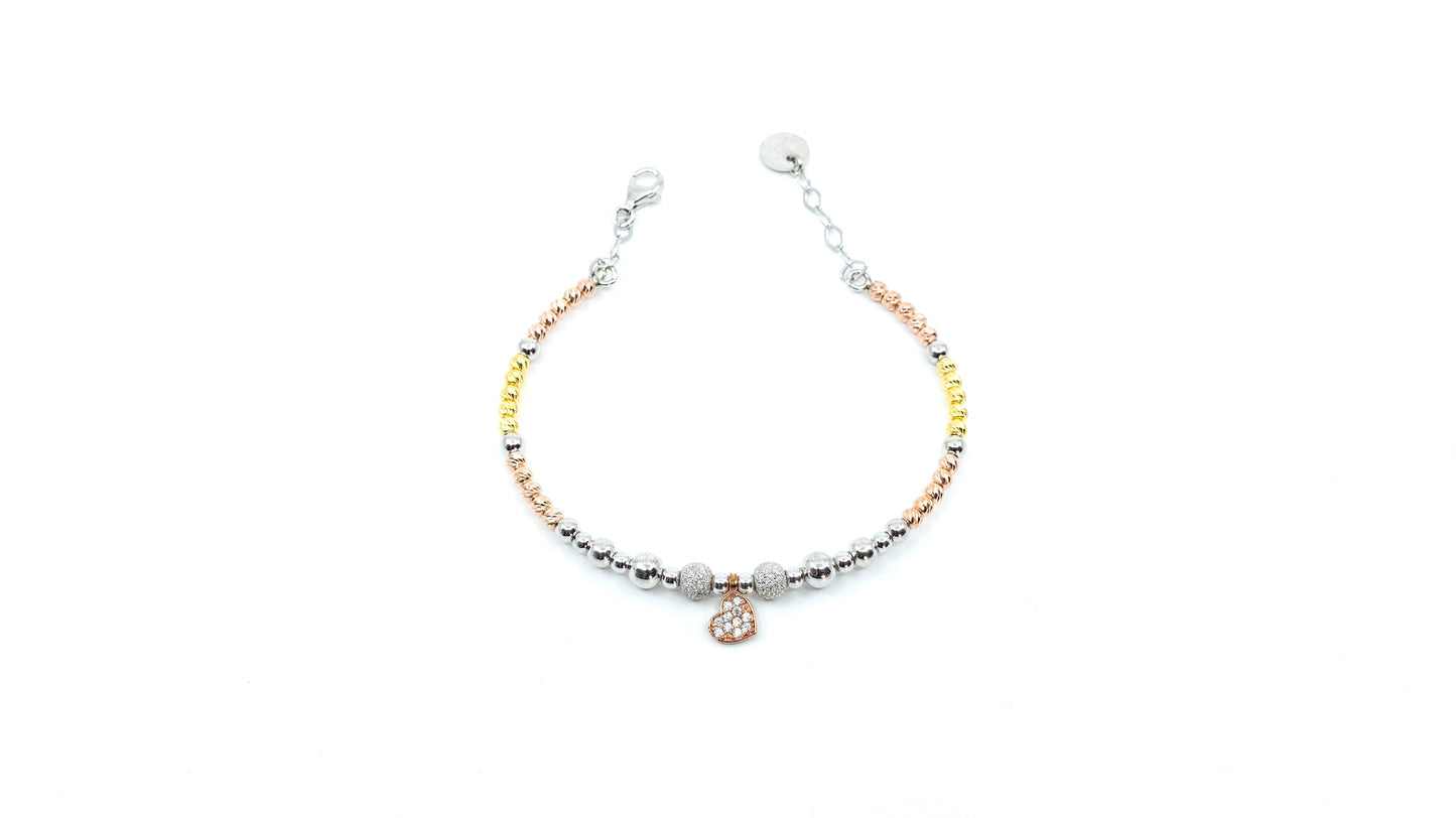 Heart bracelet with gold and silver beads